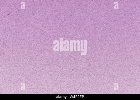 Concrete wall painted in a gentle pink gradient. Stock Photo