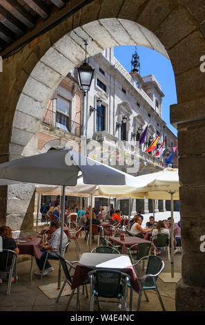 Cafe tables in The Plaza Mercado Chico with the Ayuntamiento, town hall, in the background, Avila, Spain Stock Photo