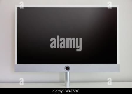 TV flat screen blank, black color, against wall background, copy space Stock Photo