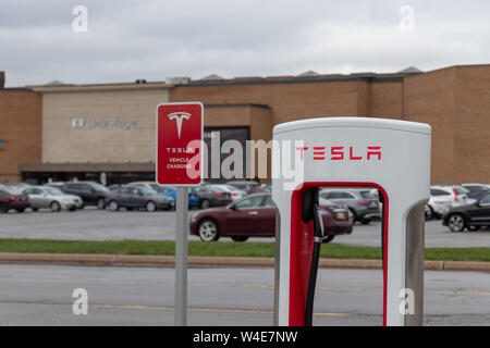 A Tesla electric car at a mall charging station Stock Photo - Alamy