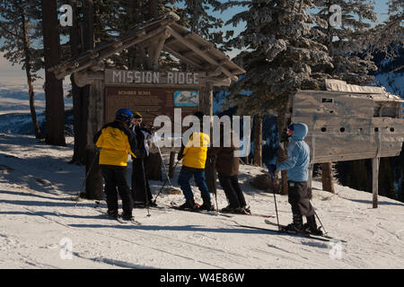 Skiers rub the wing fragment of the B-24 that crashed on Mission Ridge for good luck and to ensure it snows a lot. Many perform this ritual every run. Stock Photo