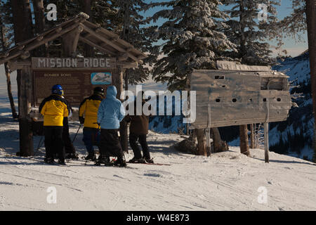 Skiers rub the wing fragment of the B-24 that crashed on Mission Ridge for good luck and to ensure it snows a lot. Many perform this ritual every run. Stock Photo