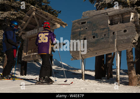 Skiers rub the wing fragment of the B-24 that crashed on Mission Ridge for good luck and to ensure it snows a lot. Many perform this ritual every run. Stock Photo