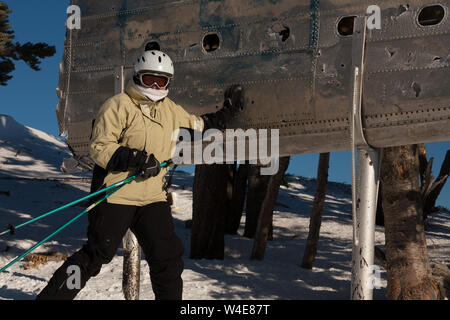 Skiers rub the wing fragment of the B-24 that crashed on Mission Ridge for good luck and to ensure it snows a lot. Many perform this ritual every run. Stock Photo