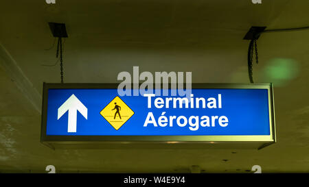 Terminal ahead, walking path sign in the parking garage of Terminal 3 at Toronto Pearson International Airport. Stock Photo