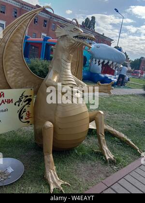 Nizhny Novgorod, Russia July 10, 2019: Moto - Family Festival 2019.  Caption: Golden Dragon good luck, defending against detractors. I bring money. Ru Stock Photo