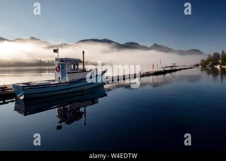 Fishing boat reflections at sunrise - Westview Marina in Tahsis, near Gold River, Vancouver Island, British Columbia, Canada Stock Photo