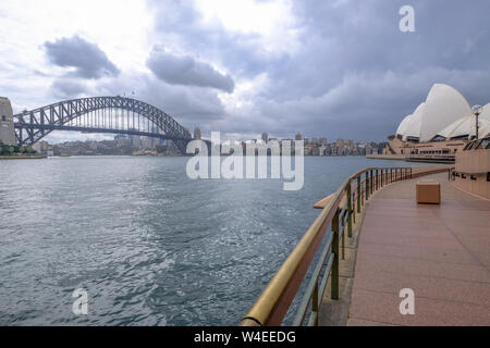 Looking out into Sydney Harbour from Circular Quay area towards North Sydney, the Opera House and the Harbour Bridge Stock Photo