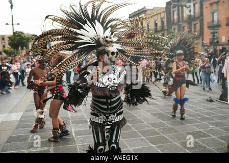 Aztec dancers (concheros) performing ritual dance at the Zocalo, Mexico City, CDMX, Mexico. Jun 2019 Stock Photo