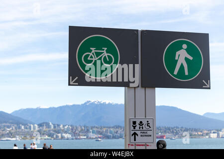 Joint bike path and walking path sign in the Vancouver Harbour at Burrard Landing. Stock Photo