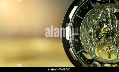 Closeup pocket watch on table and sunlight. At 8 am. o'clock in the morning. Concept of starting work today. Stock Photo