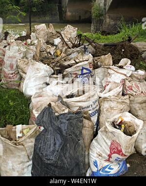 Bogor, West Java, Indonesia - July 2019 : Pack of neighborhood trash in plastic sacks. Stock Photo