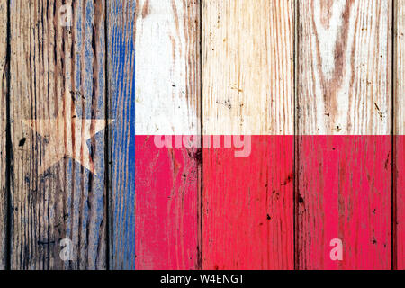 Texas US state national flag on a gray wooden boards background on the day of independence in different colors of blue red and yellow. Political and r Stock Photo