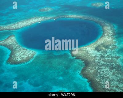 The Great Blue Hole from the air. Lighthouse Reef and Caye / Cay off Belize coast. Underwater Cenote Cave that collapsed. Limestone cave. Stock Photo