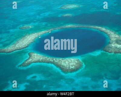 The Great Blue Hole from the air. Lighthouse Reef and Caye / Cay off Belize coast. Underwater Cenote Cave that collapsed. Limestone cave. Stock Photo