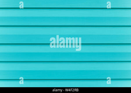 Turquoise fence. Plank - timber. Painted blue wooden table in lines. Striped panel, surface, background. Slats texture. Copy space. Abstract bright gr Stock Photo