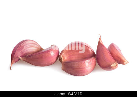 Red garlic cloves isolated on white background Stock Photo