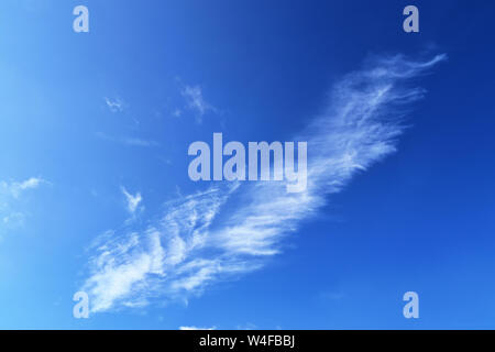 Beautiful and calming cirrus cloud formations on a deep blue summer sky Stock Photo