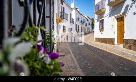 Street of Zahara the la Sierra with its white houses - Zahara de la Sierra, Cadiz Province, Andalusia, Spain Stock Photo