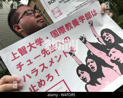Tokyo, Japan. 23rd July, 2019. A group of students protested the dismissal of a teacher who has been fired from the Sophia University under unclear reasons. According to a spokeswoman of the Sophia University, A. Kikuchi said that it is a matter that is in discussion by lawyers of both parties and that it is not known when they will have a resolution. The teacher's name is Dr. Kukhee Choo who, according to some students of the same University, give her their support, since she is being harassed and discriminated by the university only because of her teaching method in the Department of Libe Stock Photo
