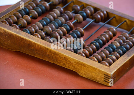 Vintage wooden abacus close up. Fragment of old abacus close up. Stock Photo