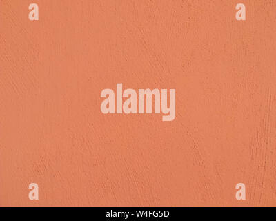 Textured plaster in coral . Background or texture seamless pattern. Stock Photo