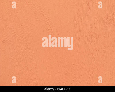 Textured plaster in coral . Background or texture seamless pattern. Stock Photo