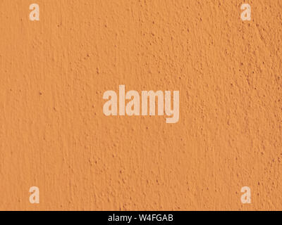 Textured plaster in terracotta . Background or texture seamless pattern. Stock Photo