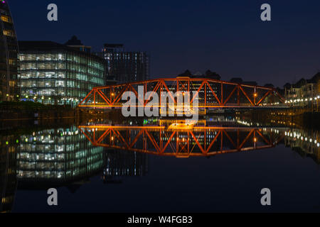 The Detroit Bridge and the Bupa Place office block over Huron Basin at night, Salford Quays, Manchester, UK. Stock Photo