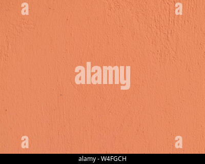Textured plaster in coral . Background or texture seamless pattern. Stock Photo