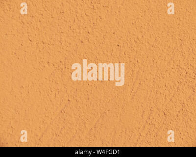 Textured plaster in terracotta . Background or texture seamless pattern. Stock Photo