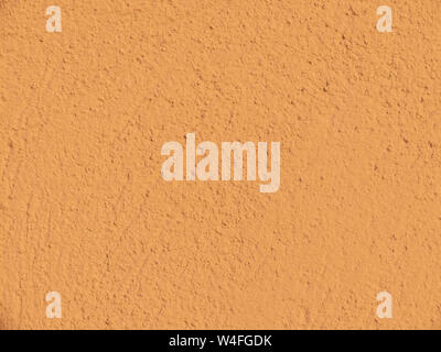Textured plaster in terracotta . Background or texture seamless pattern. Stock Photo
