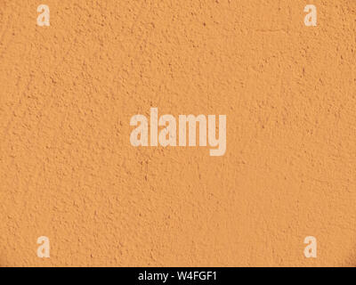 Textured plaster in terracotta . Background or texture seamless pattern. Stock Photo