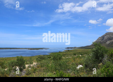 The mouth of the Bot River lagoon as it runs into the Atlantic ocean at the coastal town of Kleinmond in the Western Cape Province of South Africa. Stock Photo