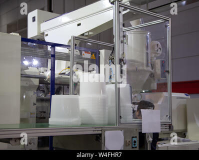Plastic buckets product from automatic plastic injection molding press machine Stock Photo