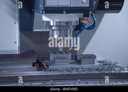 CNC milling machine cutting workpiece, industrial machining Stock Photo