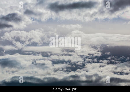 gray incoming near storm clouds daylight backdrop. Stock Photo
