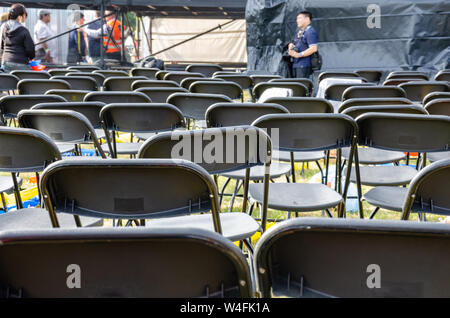 Empty rows of folding chairs at the end of a concert. Stock Photo