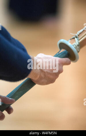 Man practicing Kendo with wooden sword. Stock Photo