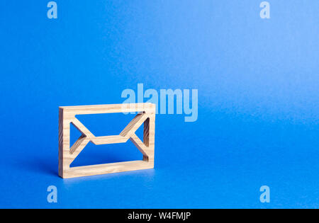 Wooden Envelope. mail address. Internet technologies and contacts. Communication over the network. Providing links and contacts on various public plat Stock Photo