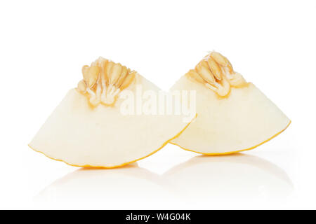 Group of two pieces of fresh yellow melon canary with seeds isolated on white background Stock Photo