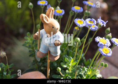 Easter decoration flowers decorated with a small wooden bunny Stock Photo