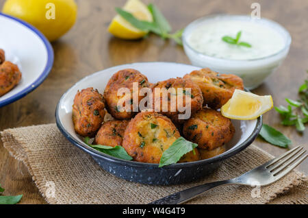 White cheese and yoghurt with courgettes ball , seasonal flavors, vegetable meatballs on the table. Stock Photo