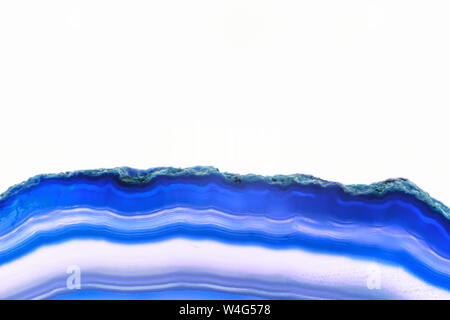Abstract background, blue agate striped slice mineral cross section on white background Stock Photo