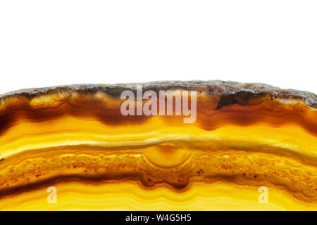 Abstract background, brown and orange striped agate slice mineral cross section isolated on white background Stock Photo