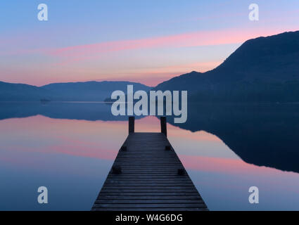 Sunrise over a slipway at Ullswater in the Lake District National Park Stock Photo