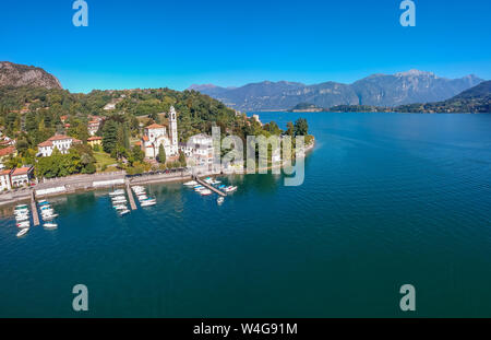 Aerial view landscape on beatiful Lake Como in Tremezzina, Lombardy, Italy. Scenic small town with traditional houses and clear blue water. Summer tou