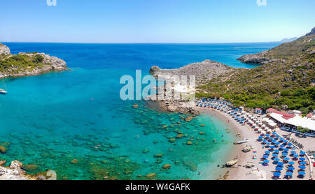 Aerial birds eye view drone photo Ladiko bay near Anthony Quinn on Rhodes island, Dodecanese, Greece. Panorama with nice lagoon and clear blue water. Stock Photo