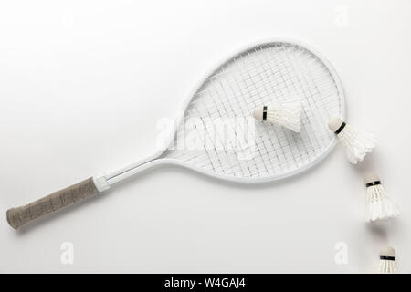 flat lay with white badminton racket and shuttlecocks on white background Stock Photo