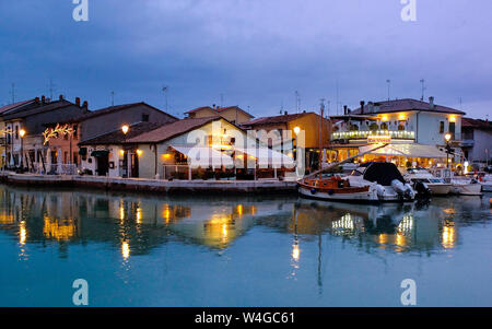 Nightime restaurants by the estuary in Cesenatico near Rimini. Stock Photo